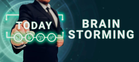 Conceptual display Brain Storming. Word for Long term marketing support for a product Marketing Man With A Pen Pointing On Digital Symbols Showing Creative Ideas.の写真素材