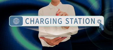 Text sign showing Charging Station. Business showcase social gathering or the entertainment provided for kids Lady in suit holding pen symbolizing successful teamwork accomplishments.の写真素材