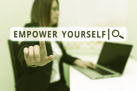 Handwriting text Empower Yourself. Business showcase provides value to the lives of your potential clients Woman Typing Updates On Lap Top And Pointing New Ideas With Pen.の写真素材