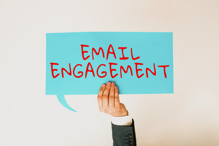 Writing displaying text Email Engagement. Business concept email sent out to inform the audience of the latest news Businessman Holding Speech Bubble With Important Messages With One Hand.の写真素材