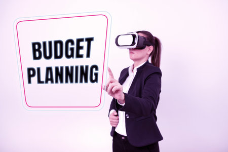 Writing displaying text Budget Planning. Word Written on purchasing process that businesses lead their customers Woman Wearing Vr Glasses And Pointing On Important Message With One Finger.の写真素材