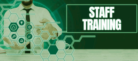 Text sign showing Staff Training. Word Written on program that helps employees learn specific knowledgeの写真素材
