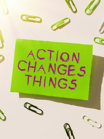 Handwriting text Action Changes Things. Word Written on doing something will reflect other things Reactionの写真素材