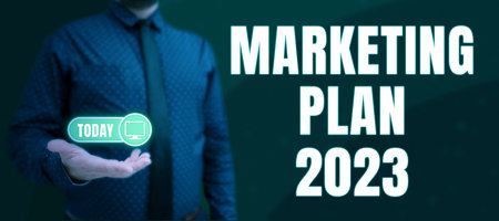 Hand writing sign Marketing Plan 2023. Business overview schedule defining brand selling way in next...