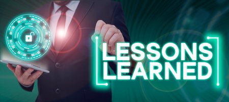Writing displaying text Lessons Learned. Concept meaning the knowledge or understanding gained by experienceの写真素材