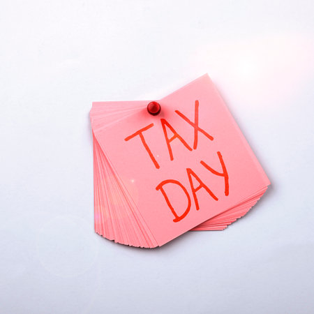 Sign displaying Tax Day. Business showcase colloquial term for time on which individual income tax returnsの写真素材