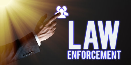 Text caption presenting Law Enforcement. Business approach activity of making certain that the laws of an area are obeyの写真素材