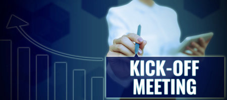 Hand writing sign Kick Off Meeting. Business concept first meeting with the project team and the clientの写真素材