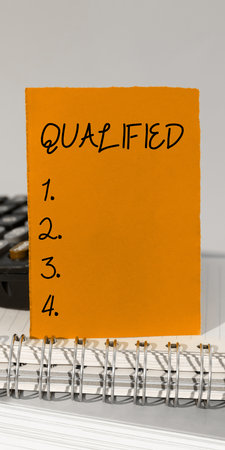 Text caption presenting Qualified. Word for Officially trained to perform a particular job Certifiedの写真素材