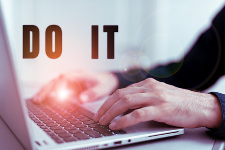 Hand writing sign Do It. Business showcase confident and willing to engage with problems or other tasksの写真素材