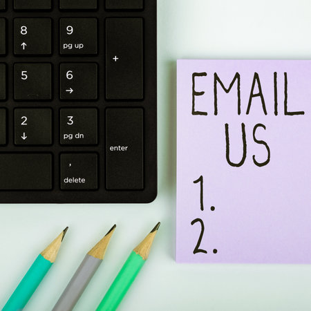 Sign displaying Email Us. Word for Sending a commercial message to a group of people using mailの写真素材