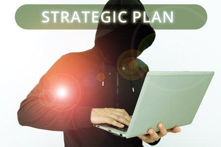 Text caption presenting Strategic Plan. Business overview A process of defining strategy and making decisionsの写真素材