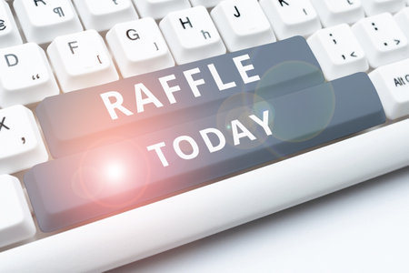Sign displaying Raffle. Conceptual photo means of raising money by selling numbered tickets offer as...