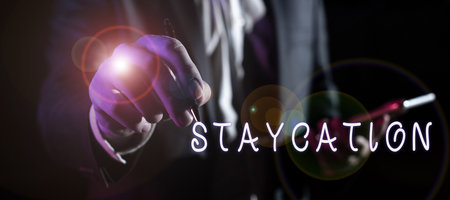 Writing displaying text Staycation. Internet Concept a vacation spent at ones home enjoying all that home environmentの写真素材