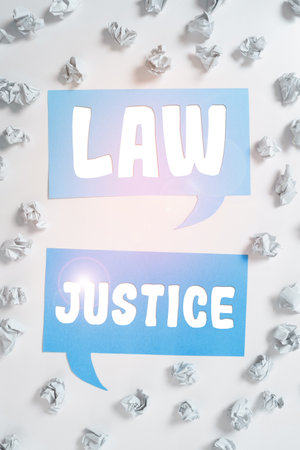Conceptual caption Law Justice. Business idea a scheme or system of law in which every person receivesの写真素材