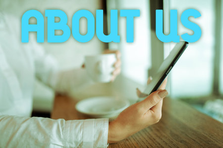 Hand writing sign About Us. Internet Concept to introduce who or what something relates to or...