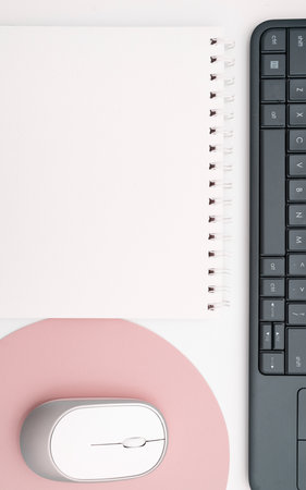 Colored paper with important message lying desk near keyboard. Main information written on notebook. School supplies. Multiple Assorted Collection Office Stationery.の写真素材