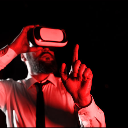 Man Wearing Vr Glasses And Pointing On Important Messages With One Finger. Businessman Having Virtual Reality Eyeglasses And Showing Crutial Informations.の写真素材