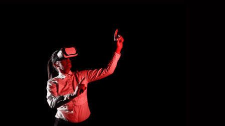 Woman Wearing Vr Glasses And Pointing On Important Messages With One Finger. Businesswoman Having Virtual Reality Eyeglasses And Showing Crutial Informations.の写真素材