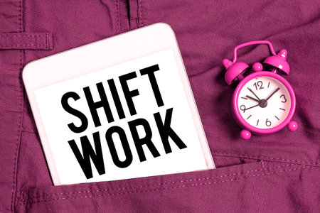 Hand writing sign Shift Work. Internet Concept work comprising periods in which groups of workers do the jobs in rotationの写真素材