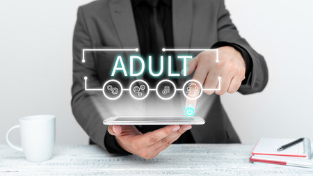 Conceptual caption Adult. Business concept Finding ways to educate a mature son, daughterの写真素材