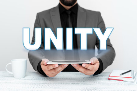 Text showing inspiration Unity. Business overview state of being united or joined as whole becoming one personの写真素材