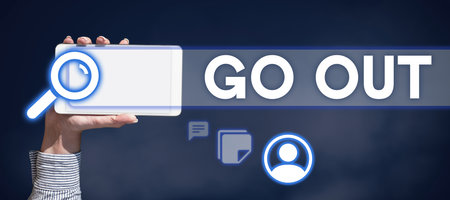 Text caption presenting Go Out. Word Written on to leave a room or building, especially in order to do somethingの写真素材