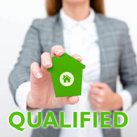 Hand writing sign Qualified. Word Written on Officially trained to perform a particular job Certifiedの写真素材