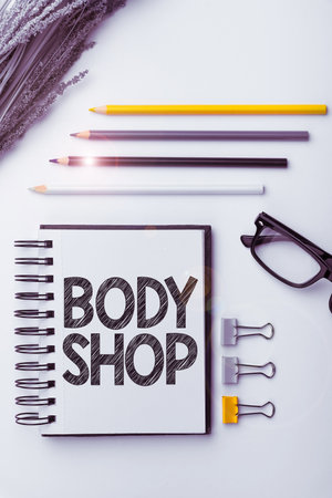 Hand writing sign Body Shop. Business overview a shop where automotive bodies are made or repairedの写真素材