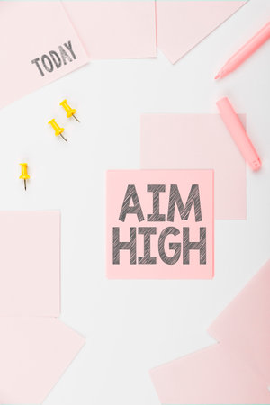Inspiration showing sign Aim High. Business idea go for best job school or activity Asking someone to dream bigの写真素材