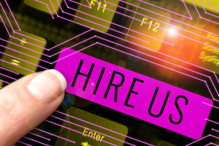 Text caption presenting Hire Us. Business showcase Used by human resources indicate employee that he is got jobの写真素材