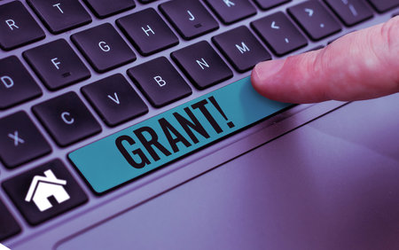 Text caption presenting Grant. Concept meaning Money given by an organization or government for a purpose Scholarshipの写真素材