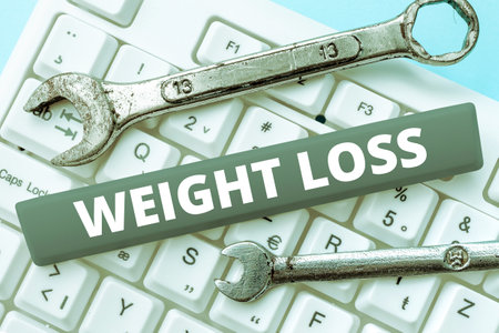 Hand writing sign Weight Loss. Internet Concept Decrease in Body Fluid Muscle Mass Reduce Fat Dispose Tissueの写真素材