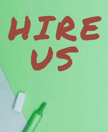Hand writing sign Hire Us. Concept meaning Used by human resources indicate employee that he is got jobの写真素材