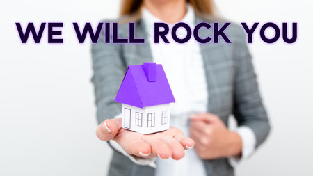 Conceptual display We Will Rock You. Business showcase to be going out and facing the world and all that is in itの写真素材