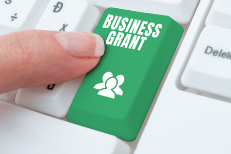 Writing displaying text Business Grant. Concept meaning Working strategies accomplish objectivesの写真素材