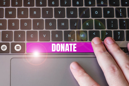 Handwriting text Donate. Word for give money or goods for good cause for example to charity or peopleの写真素材