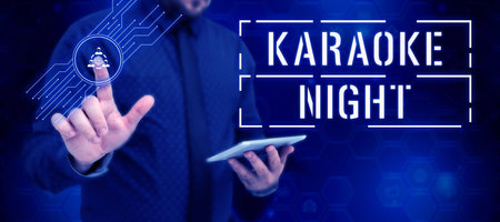 Hand writing sign Karaoke Night. Concept meaning Entertainment singing along instrumental music played by a machineの写真素材