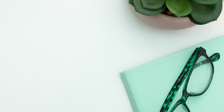 Office Supplies Over Desk With Keyboard And Glasses And Coffee Cup For Working Remotely,の写真素材