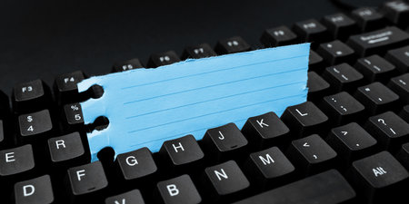 Colored sticker lying on black keyboard. Important information written over paper. Image with school supplies. Multiple Assorted Collection Office Stationery.の写真素材
