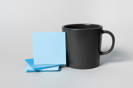 Coffee Cup on Desk. Important information written on paper.の写真素材