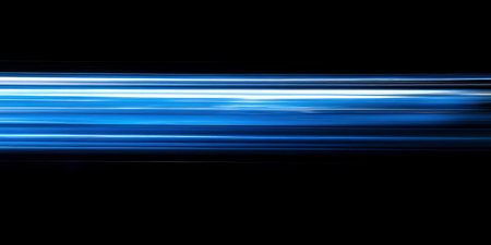 Dynamic blue light streaks create an abstract effect against a black backdrop This image is perfect for technology or futuristic themed designs.の素材