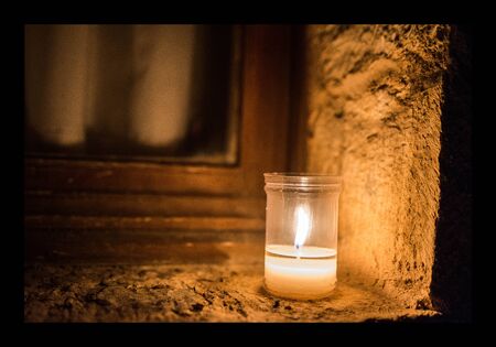 candle in the windowの写真素材