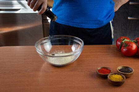 Mature woman doing the seitan cooking process at home. How to prepare seitan at home vegan meatの写真素材