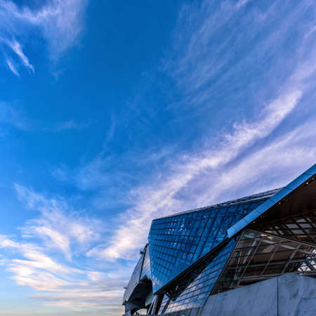 Lyon, France - 05 13 2016: The MusÃ©e des Confluences, situated on the confluence of the Rhone and the SaÃ´ne rivers. Deconstructivist architectural design of stainless steel and glass under blue skyのeditorial素材