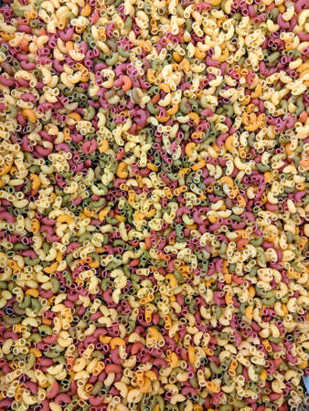 Colorful tricolore (three color) maccheroni pasta in a zero waste store ready to be sold unpackaged...