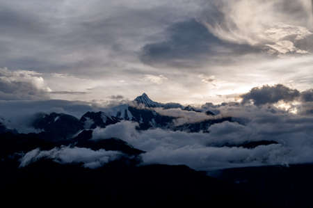 Snow capped peak of sacred mountain Kawagarbo (Khawa Karpo, Kawadgarbo, Khawakarpo, Moirig...