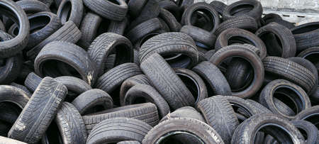 Waste tires no longer suitable for use on vehicles due to wear and are are among most problematic sources of waste. Editorial because of (barely) visible brand and model namesのeditorial素材