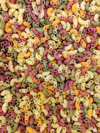 Colorful tricolore (three color) maccheroni pasta in a zero waste store ready to be sold unpackaged for environmentally conscious shoppingの写真素材