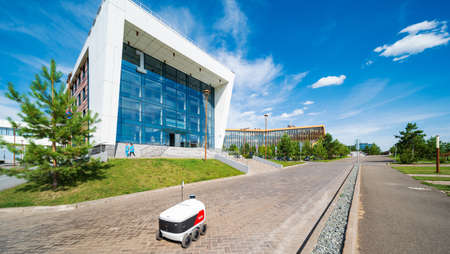 Innopolis, Russia - 08 01 2021: a Yandex.Rover delivery robot autonomously navigates the roads and...